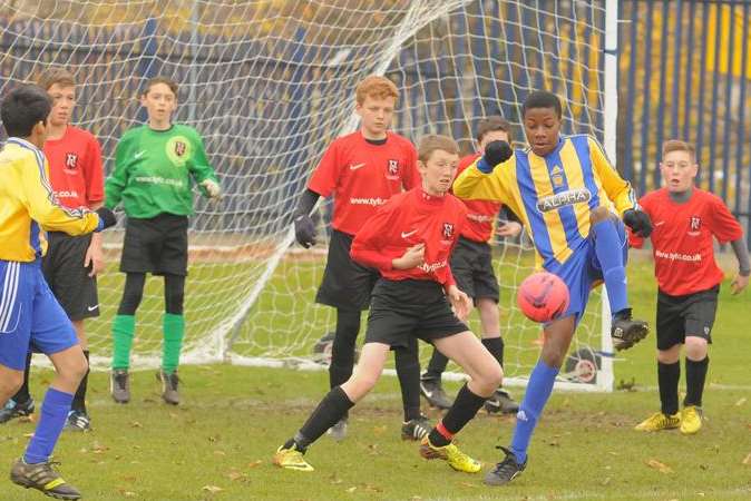 Goalmouth action between Guru Nanak Youth, stripes, and Thamesmead in under-13 Division 2. Picture: Steve Crispe