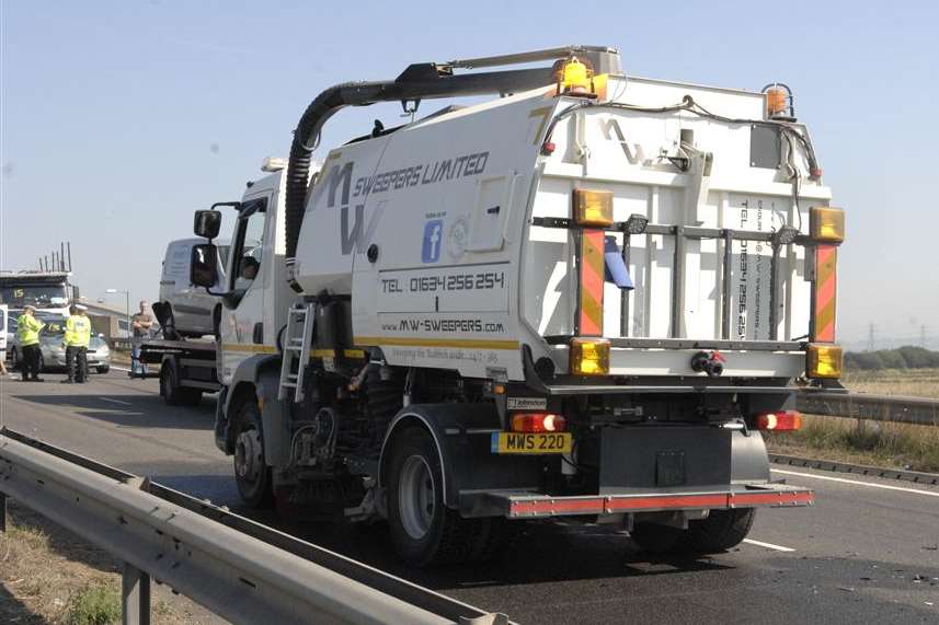 A road sweeper begins the clear up at the Sheppey Crossing
