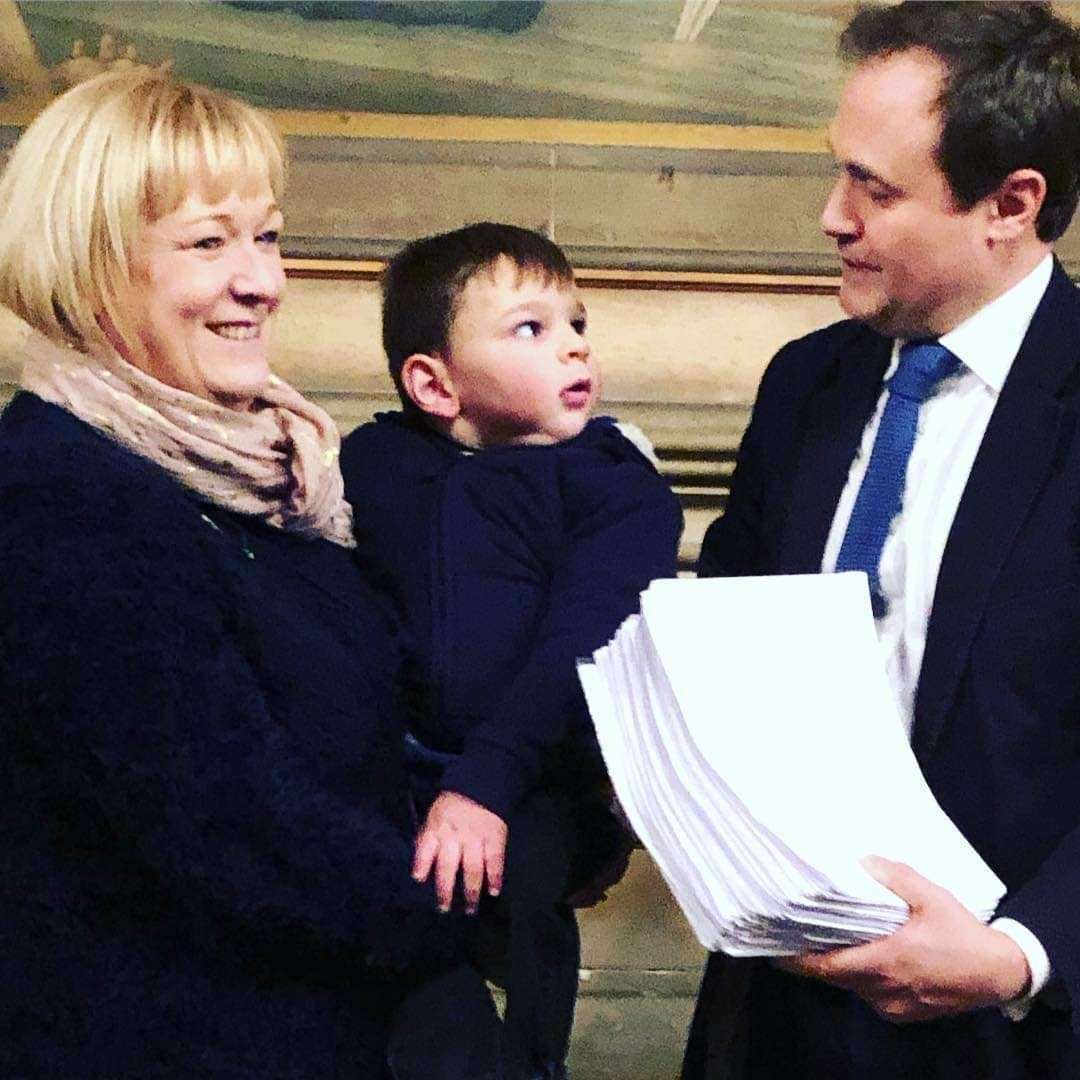 Paula Hudgell with Tony and MP Tom Tugendhat at parliament (6408471)