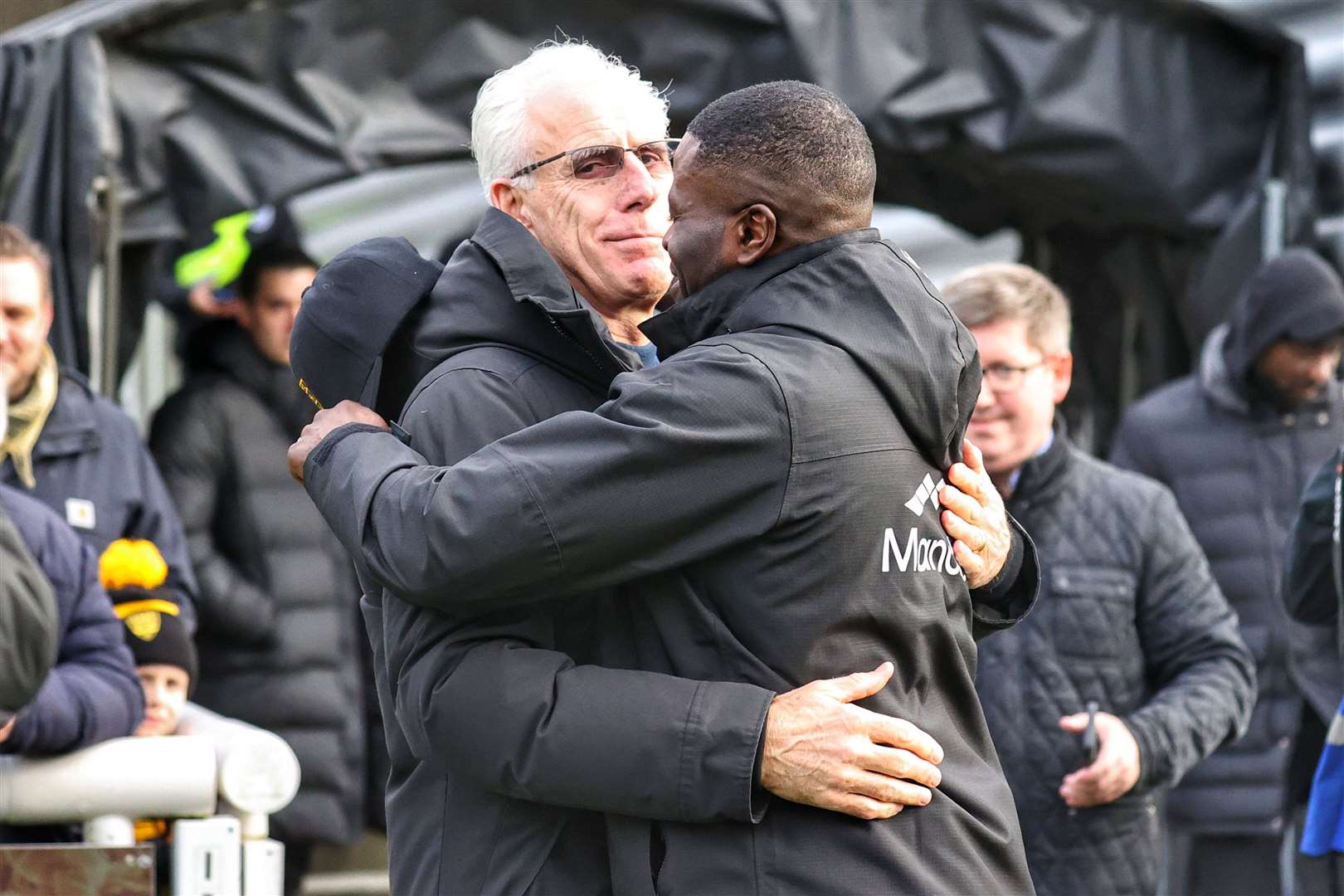 Mick McCarthy and George Elokobi embrace before the game. Picture: Helen Cooper
