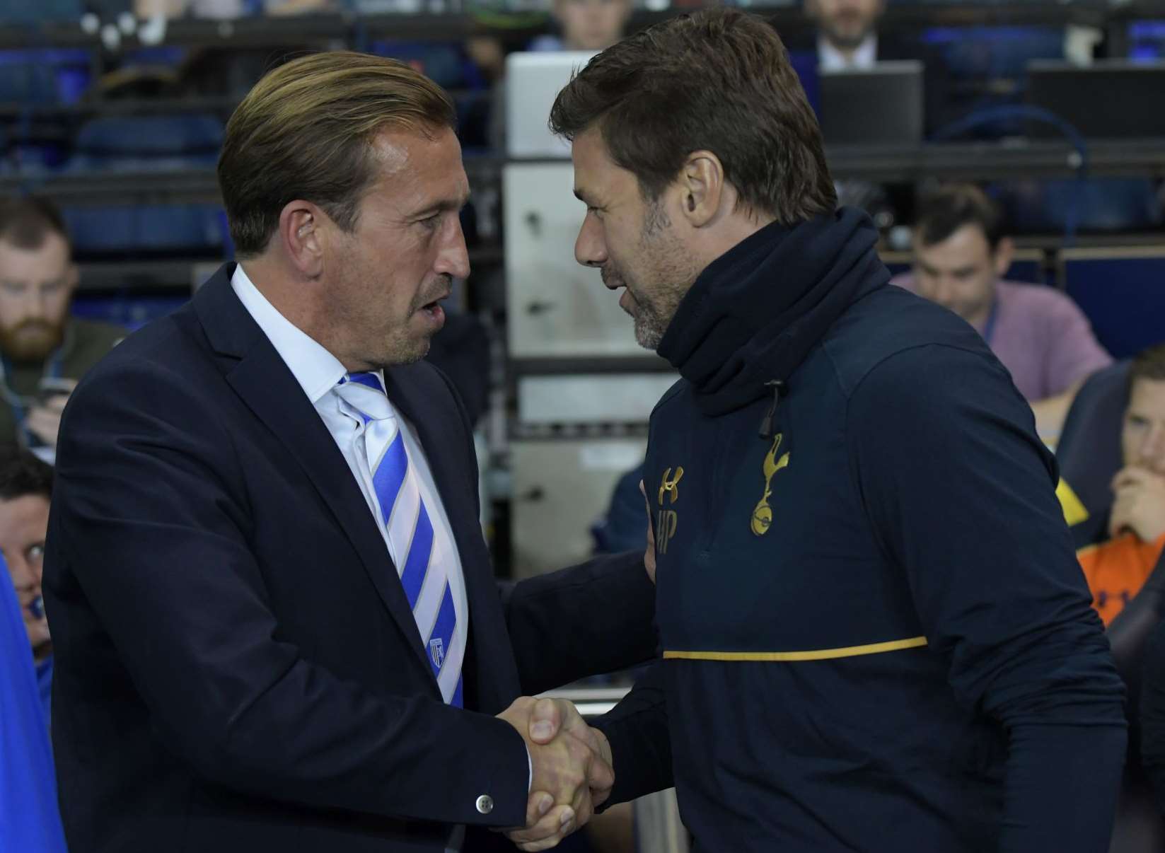 Gills boss Justin Edinburgh with Tottenham manager Mauricio Pochettino. Picture: Barry Goodwin