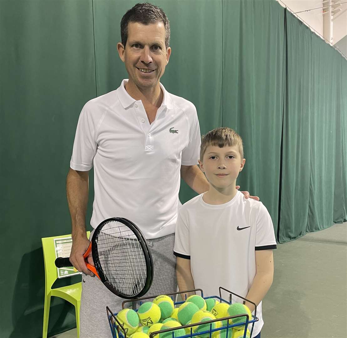 Tennis star Tim Henman with nine-year-old Sam Dennison from Kingsdown