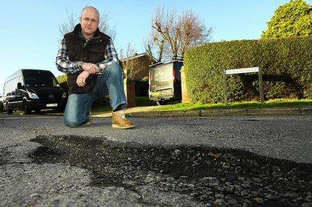 David Wiggens, beside the large pothole at the junction of Avery Way and Queensway, Allhallows. He has been fighting to get this repaired for over three years after he fell in it, damaging his knee.