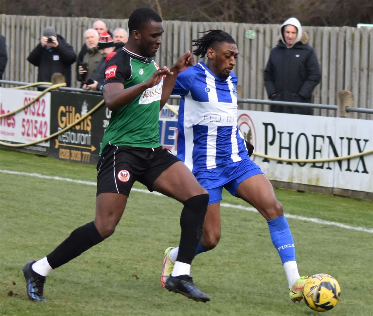Herne Bay’s Gil Carvalho holds off a challenge at Phoenix Sports. Picture: Alan Coomes