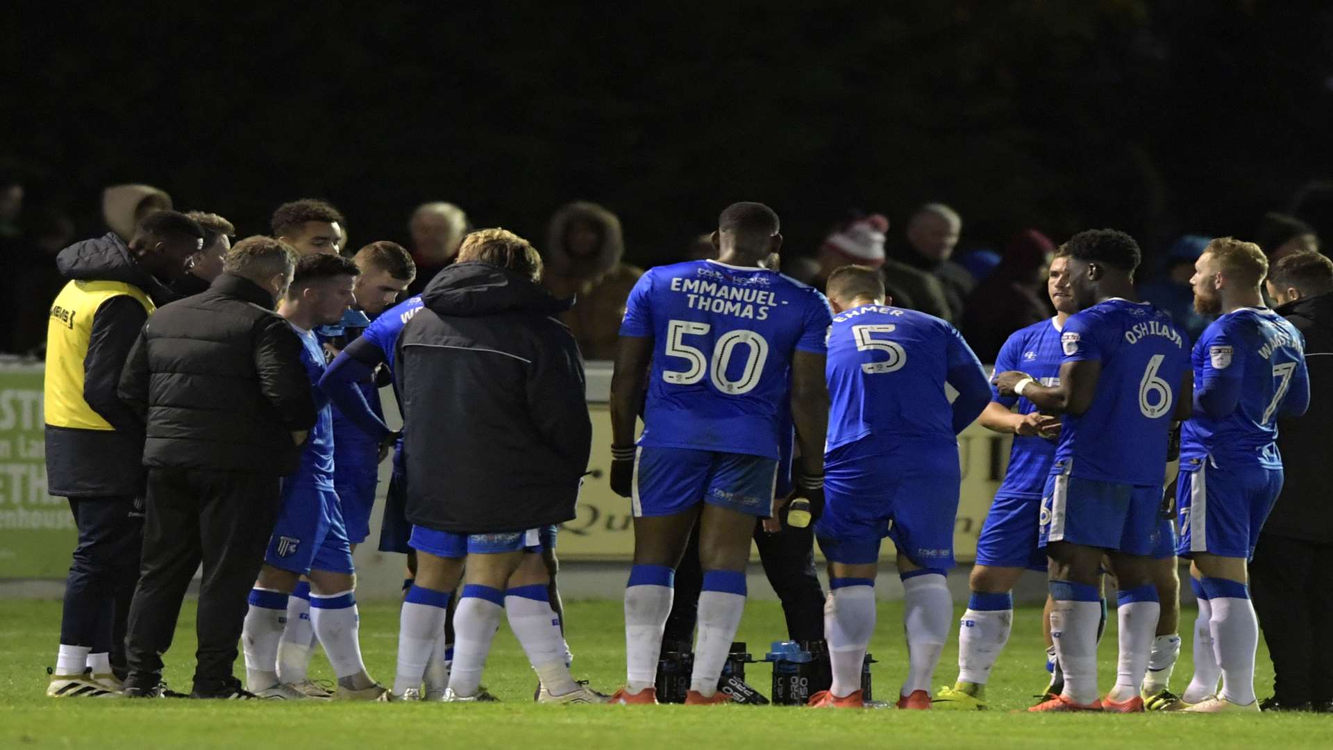 Justin Edinburgh gives a team talk during a difficult night at Brackley Picture: Barry Goodwin