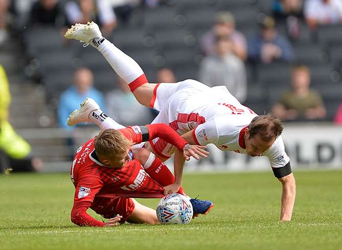 Gills striker Liam Nash in the thick of it at MK Dons Picture: Ady Kerry