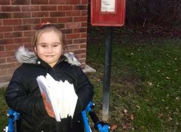Angel Farley delivering the first batch of Christmas cards