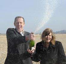 Hythe angler Ron Warne and wife Sue celebrating a £1million EuroMillions win