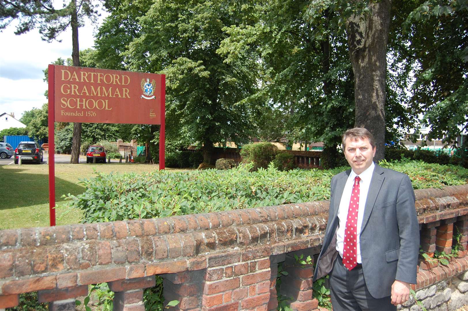Dartford MP Gareth Johnson outside his old school