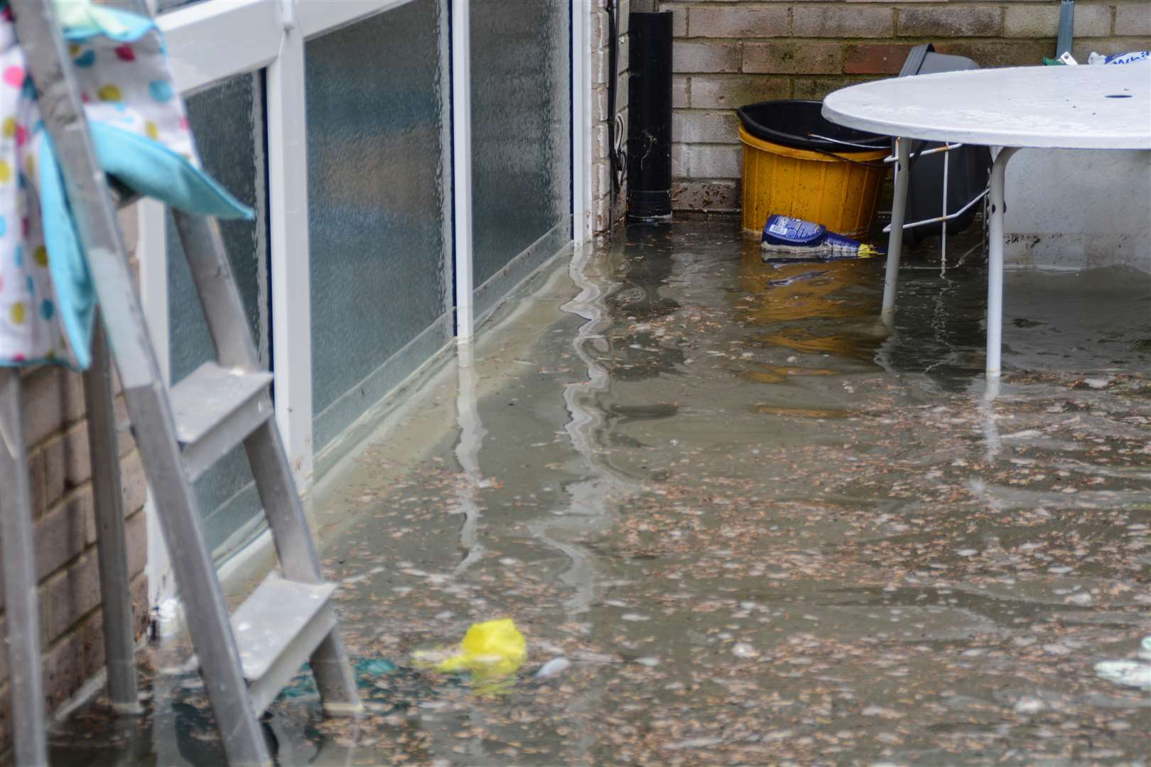 Flood water seeps into a home. Credit: Jackie Andrews and Patrick Fowler in Downs Road