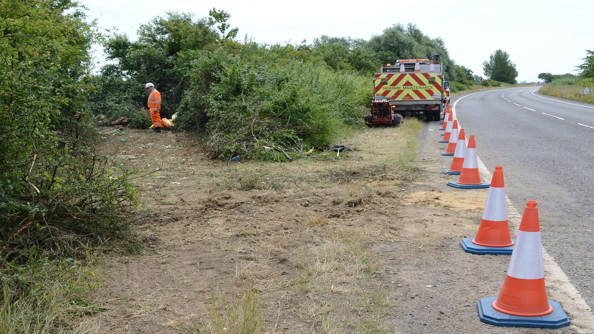 Traffic cones left by highway workers dealing with the A2070 crash.