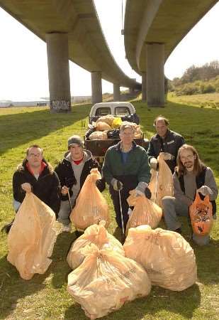 Volunteers with some of the rubbish collected at Holywell Fen