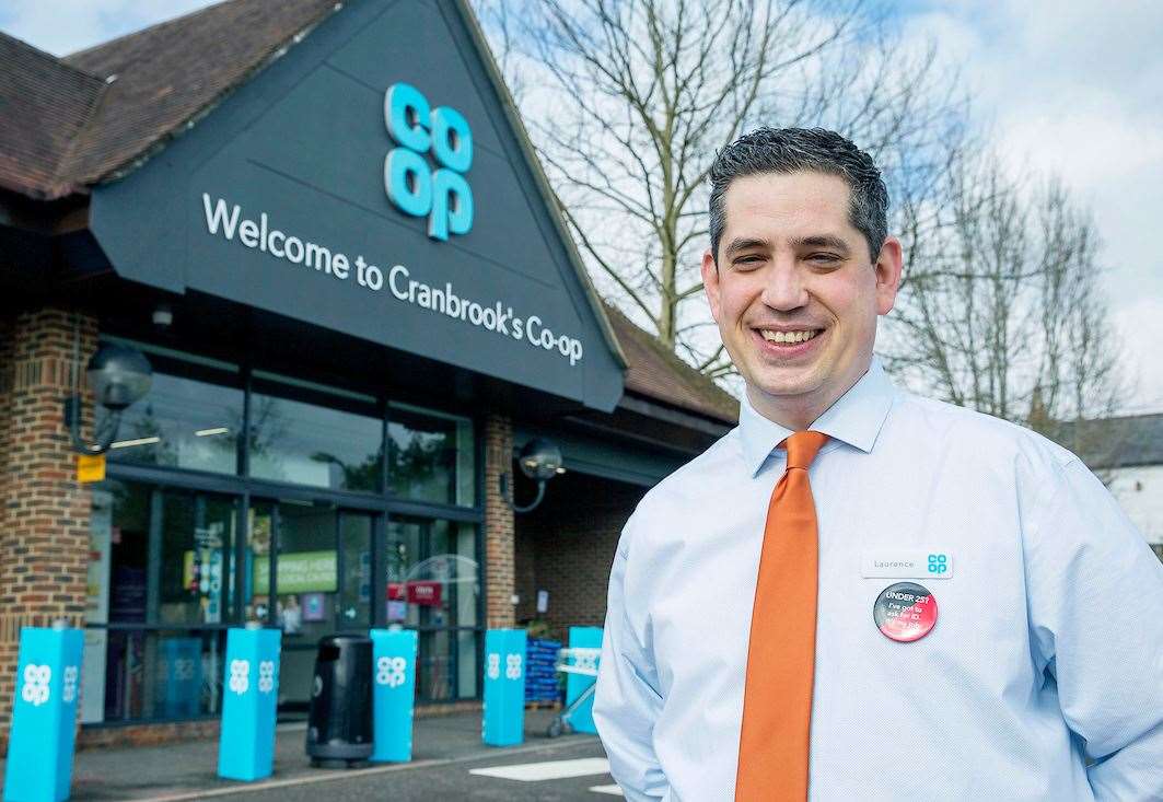 Co-op store manager Laurence Hernandez is all smiles. Picture: David McHugh