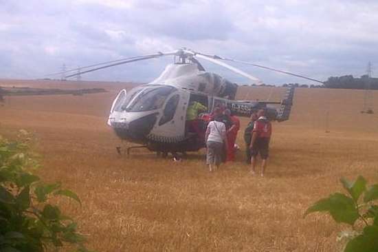 Kent Air Ambulance lands on farmland near Tilmanstone. Picture: Brian Mountain
