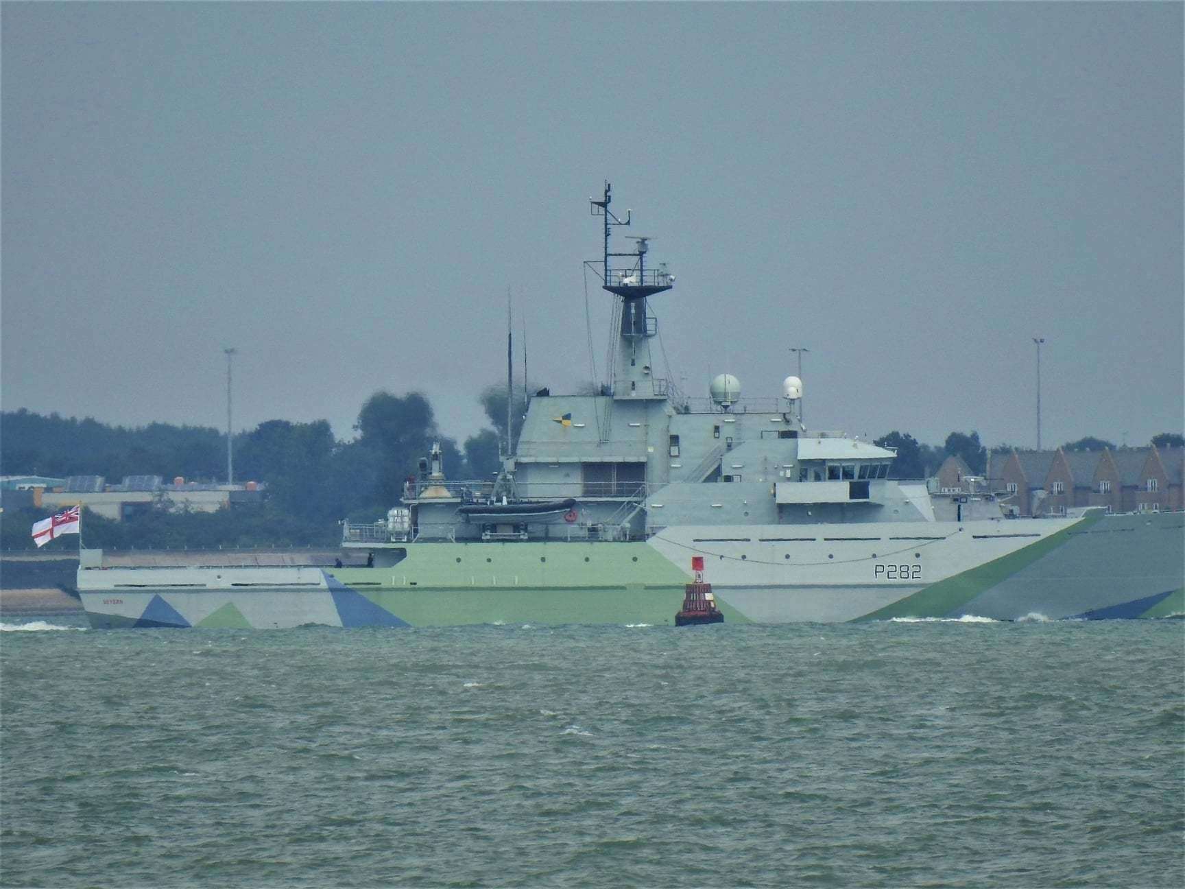 The camouflaged Royal Navy patrol boat HMS Severn passing the wreck of the American bomb ship SS Richard Montgomery off Sheerness after being recommissioned in London. Picture: Adam Young/Swale Weather