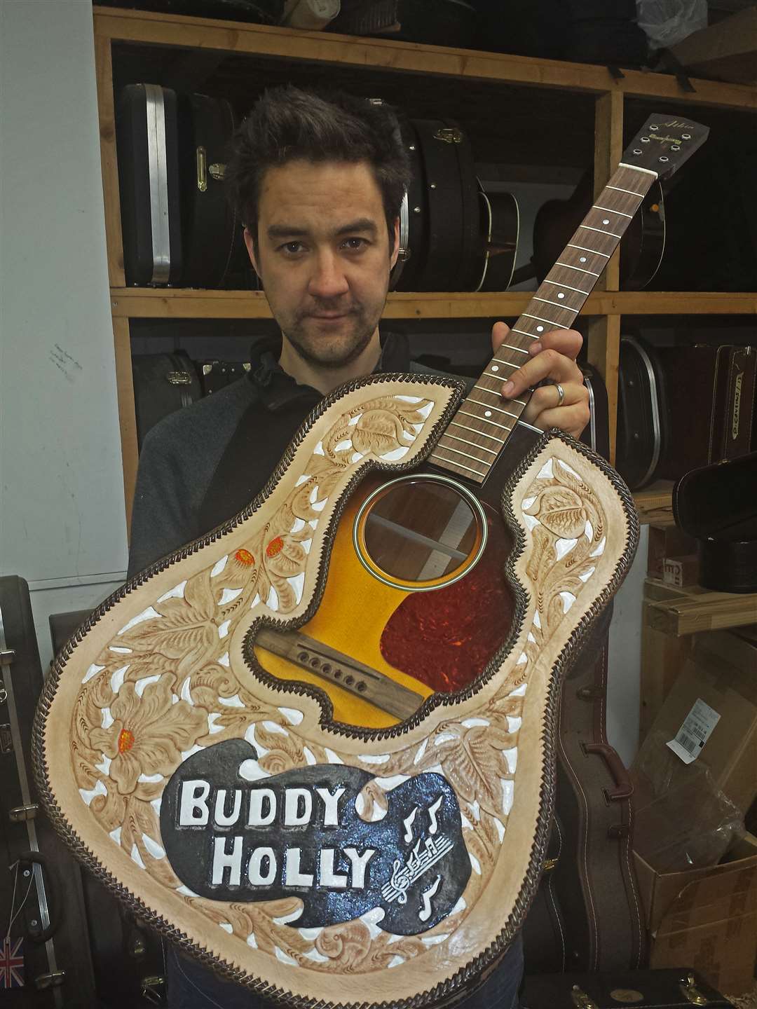 Alister Atkin with the Buddy Holly commemorative guitar he made