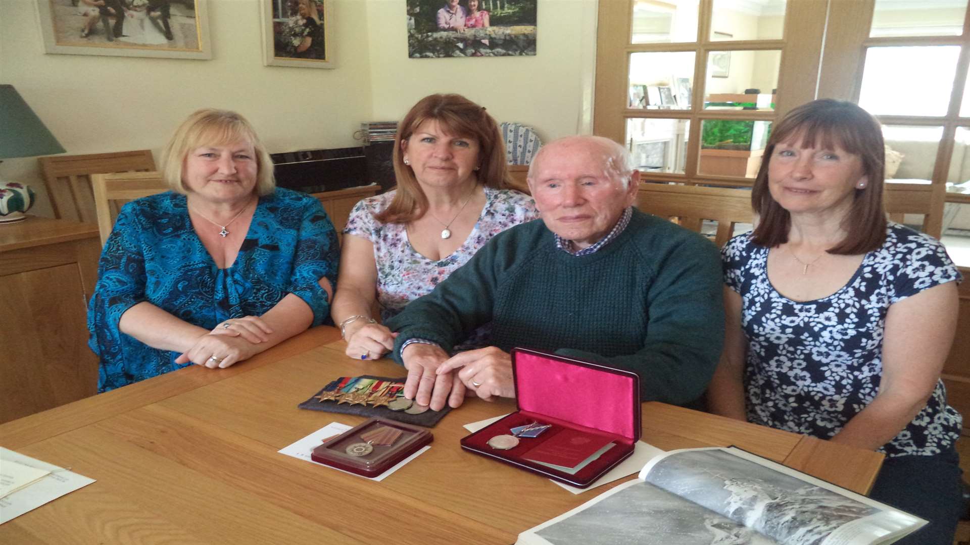 Arthur Woodyet and his daughters Janet, Christine and Barbara, and a collection of his medals from the Second World War