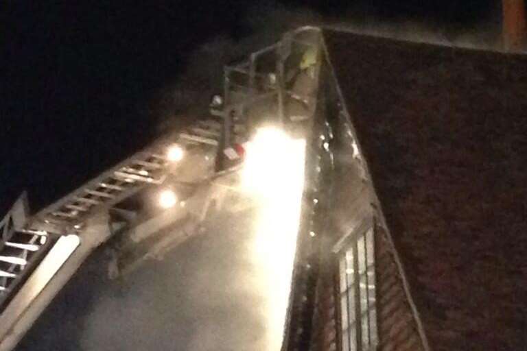 Crews use a cherry picker to fight the fire from above. Picture: @TenterdenTown