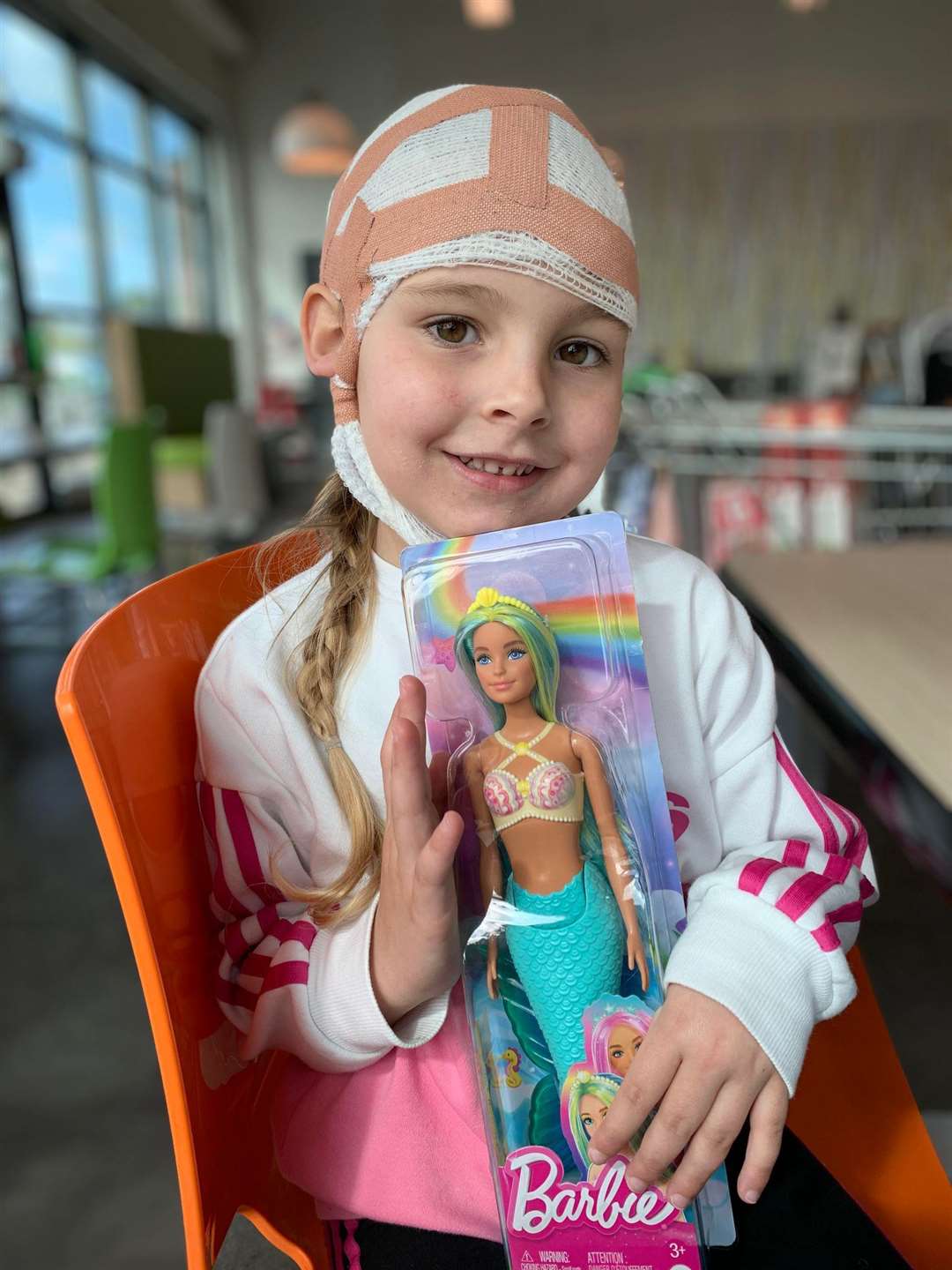Grace with her new Barbie toy gifted to her by a stranger in Asda