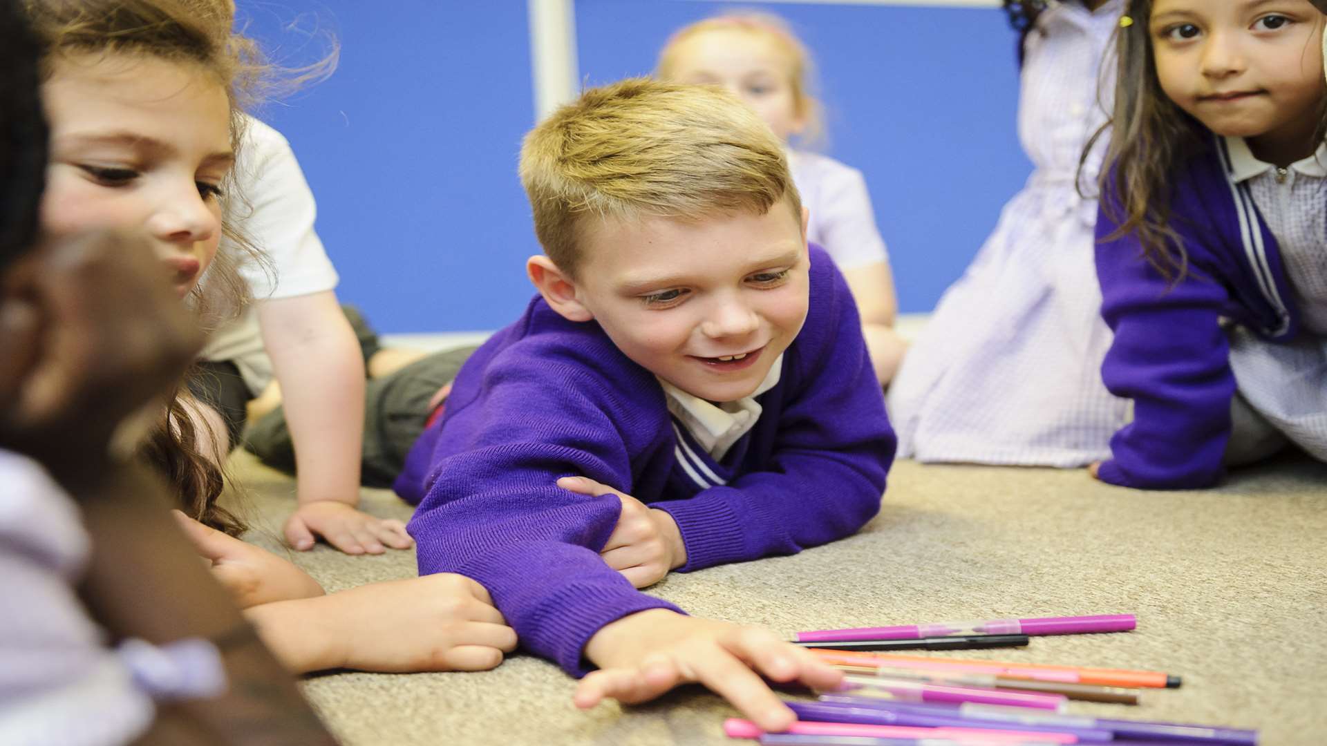 Jimmy, 7, practices his French numbers on pens.