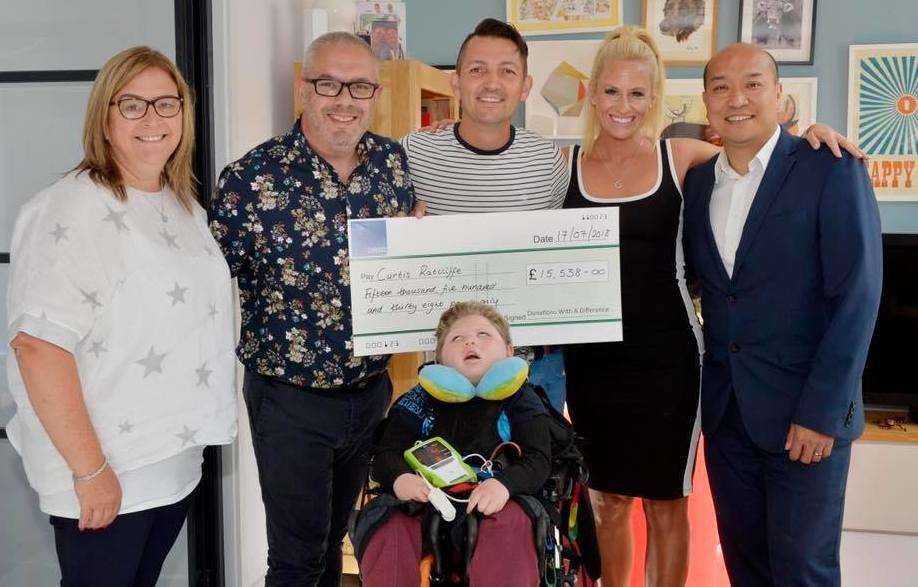 Charity Donations with a Difference presenting the cheque to Garry and Kyle Ratcliffe and their son Curtis (3221703)