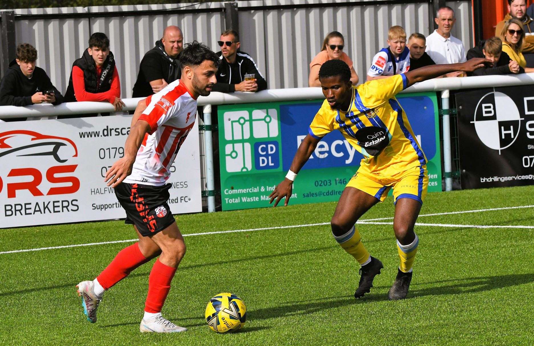 Sheppey winger James Bessey-Saldanha faces up to Sittingbourne defender Donvieve Jones during their FA Trophy tie on Saturday. Picture: Marc Richards
