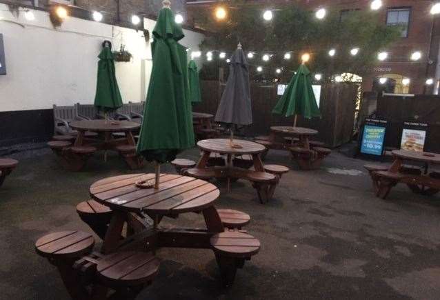 There are plenty of tables in outside patio area at the back of the pub