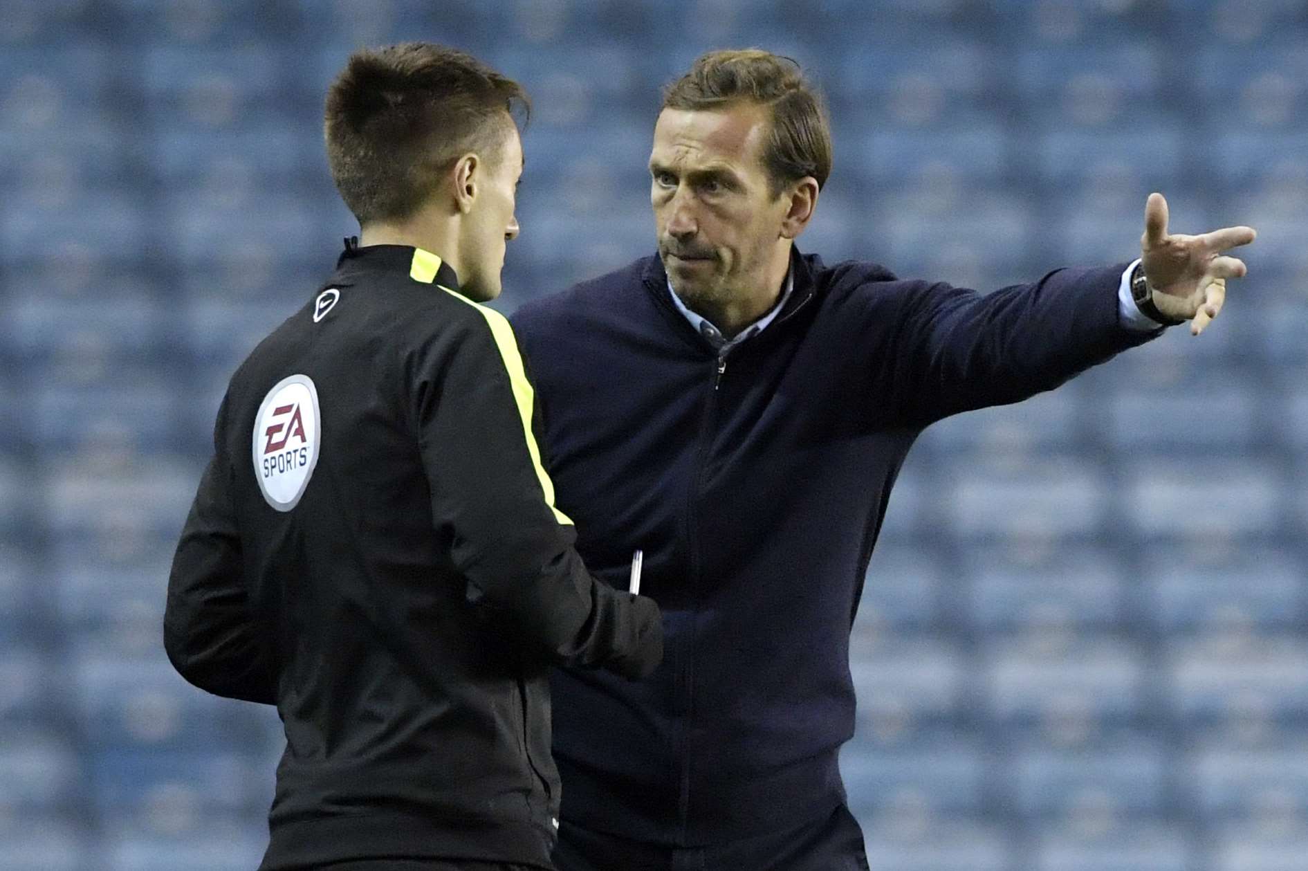 Gills manager Justin Edinburgh makes his point at Millwall on Tuesday Picture: Barry Goodwin