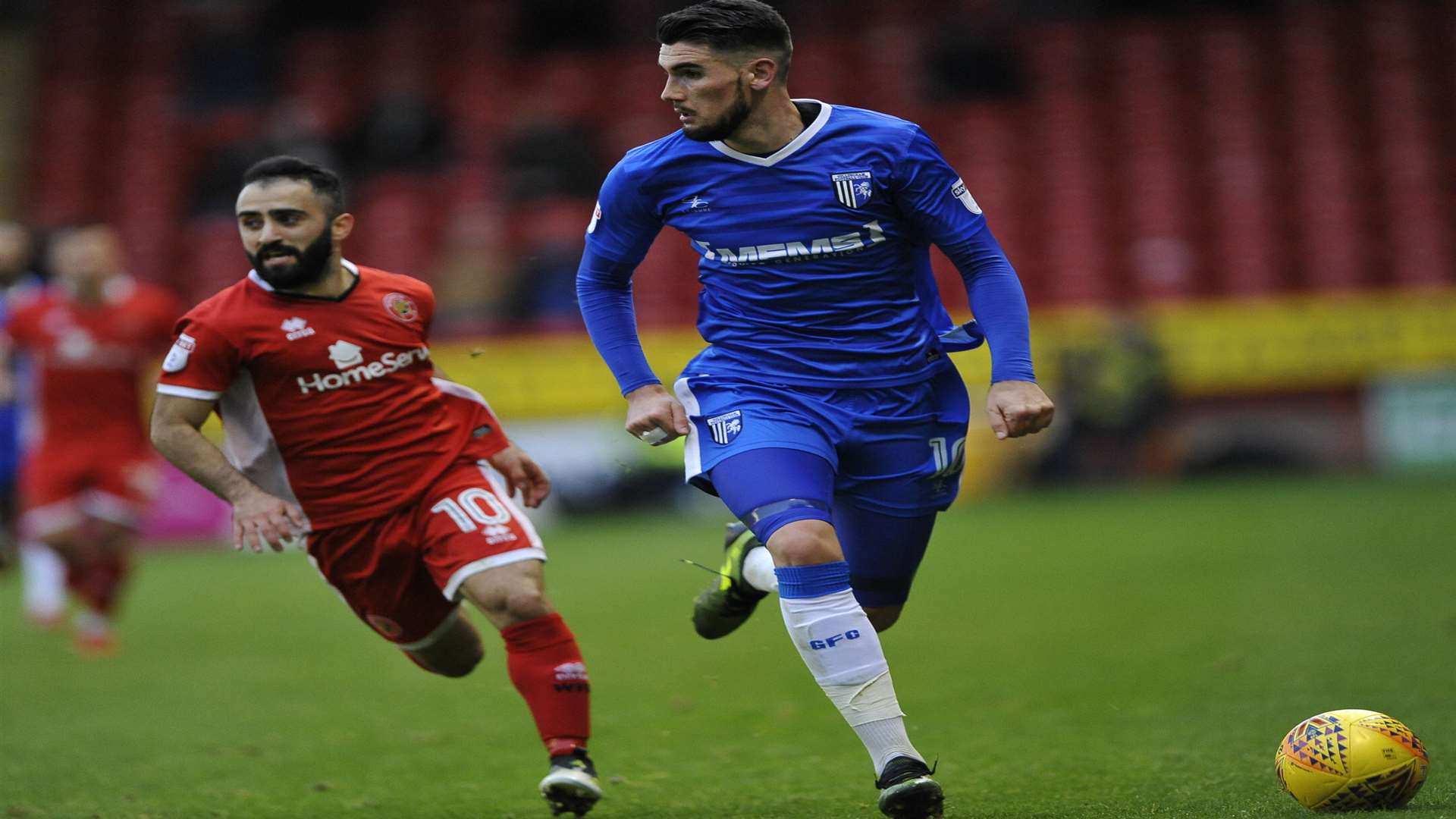 Conor Wilkinson pursued by Walsall's Erhun Oztumer Picture: Ady Kerry