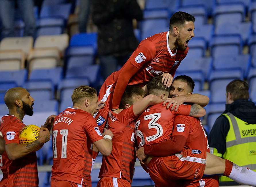 Gillingham celebrate their equaliser at Shrewsbury Picture: Ady Kerry