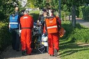 Emergency services convey the casualty to the air ambulance
