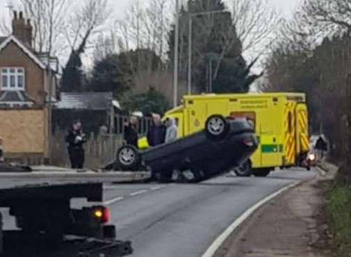 Police and an ambulance were called to London Road, Upchurch, after a car overturned. Picture: Tania Louise Devlin