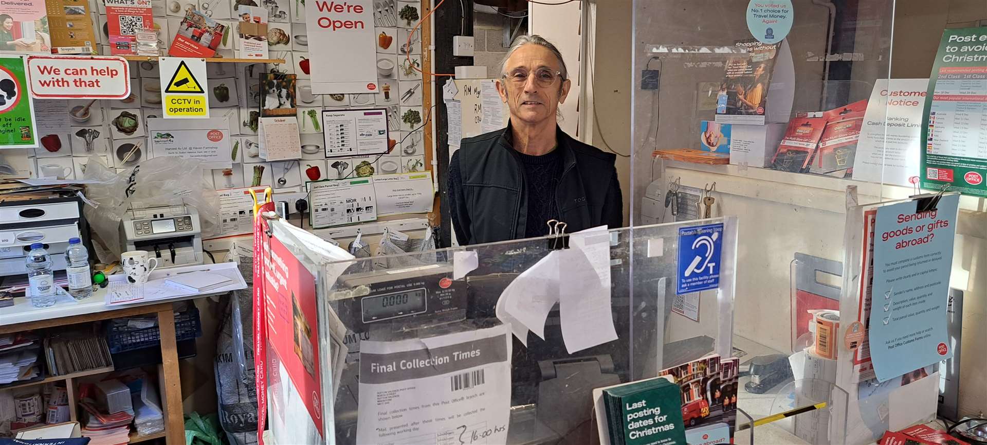Derek Eagle behind his Post Office counter