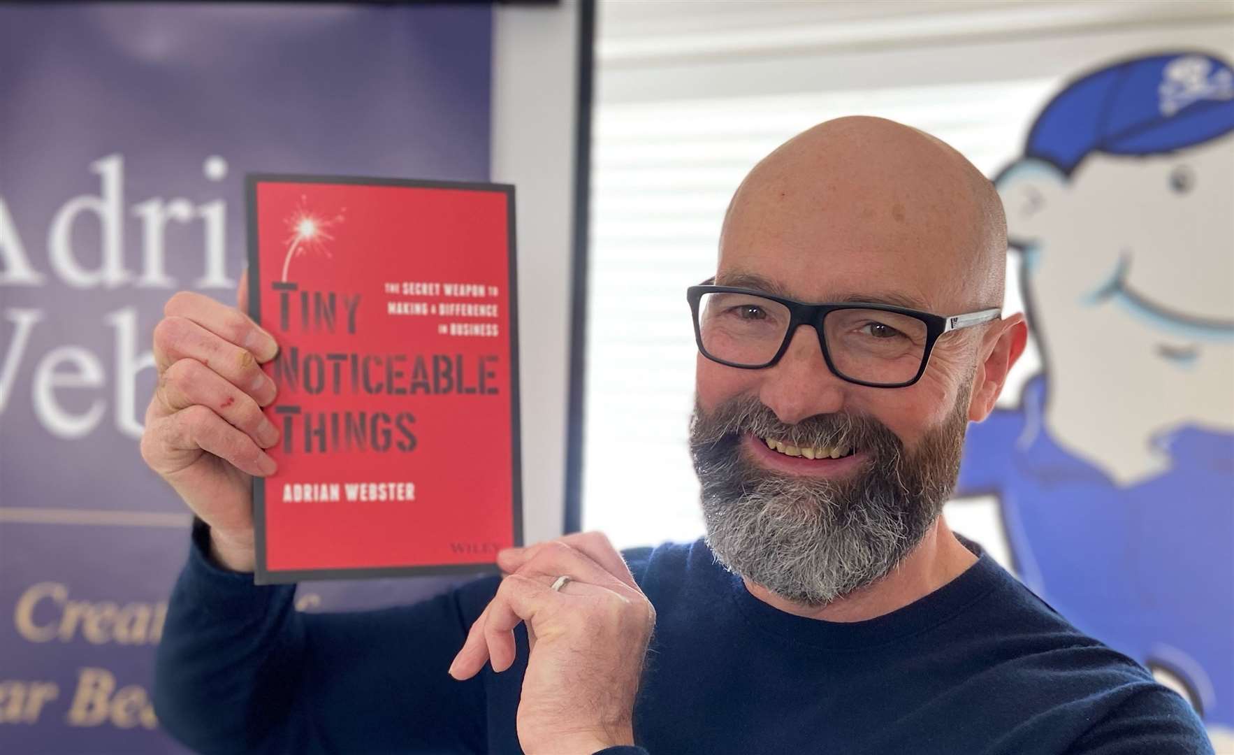 Adrian Webster with his new book