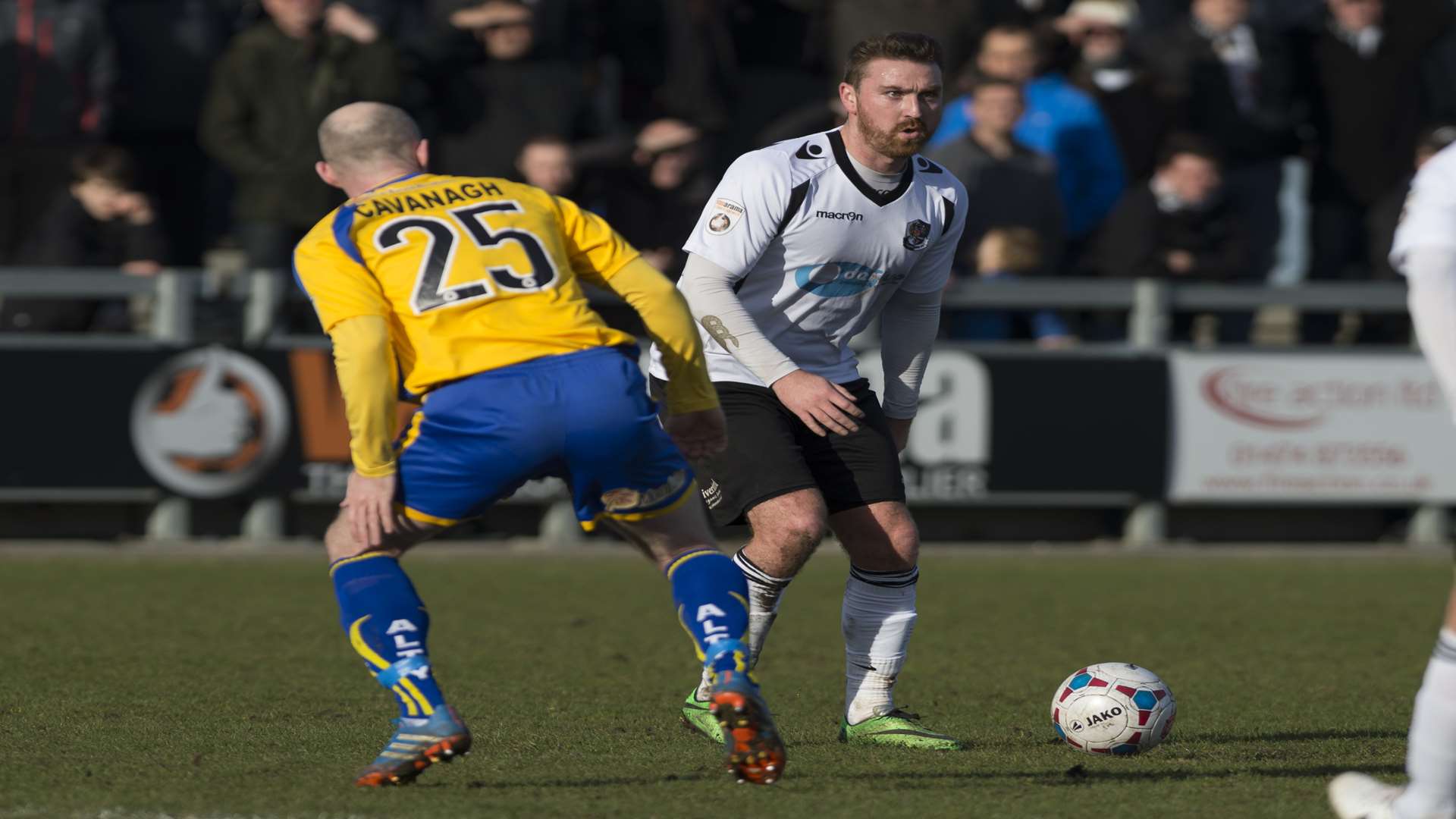 Dartford midfielder Peter Sweeney takes on Altrincham's Peter Cavanagh Picture: Andy Payton