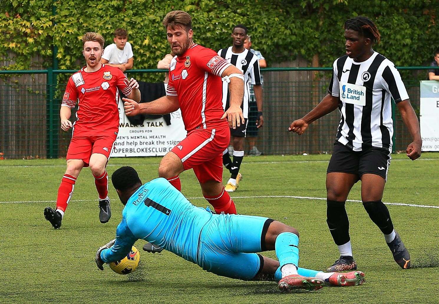 Fisher keeper Sam Amedu saves at the feet of Fjord Rogers. Picture: Les Biggs