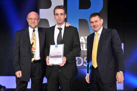 Steve Grimshaw, centre, receives Regeneration and Renewal award for empty homes scheme from BBC Newsnight’s Paul Mason, right.