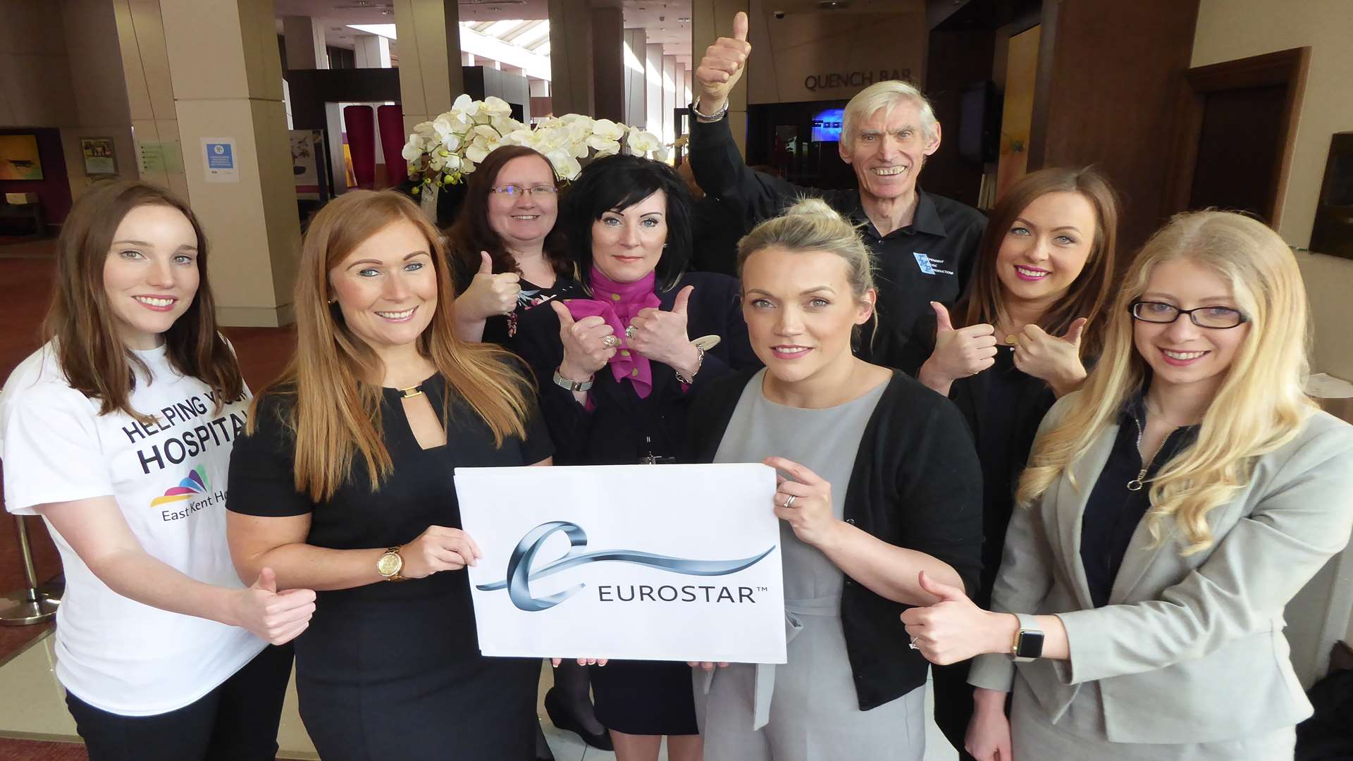 Lindsay Bonner of Office Angels and Naomi Hayden of Hallett & Co join event partners to unveil the Eurostar voucher that will be won at the KM Big Charity Quiz.