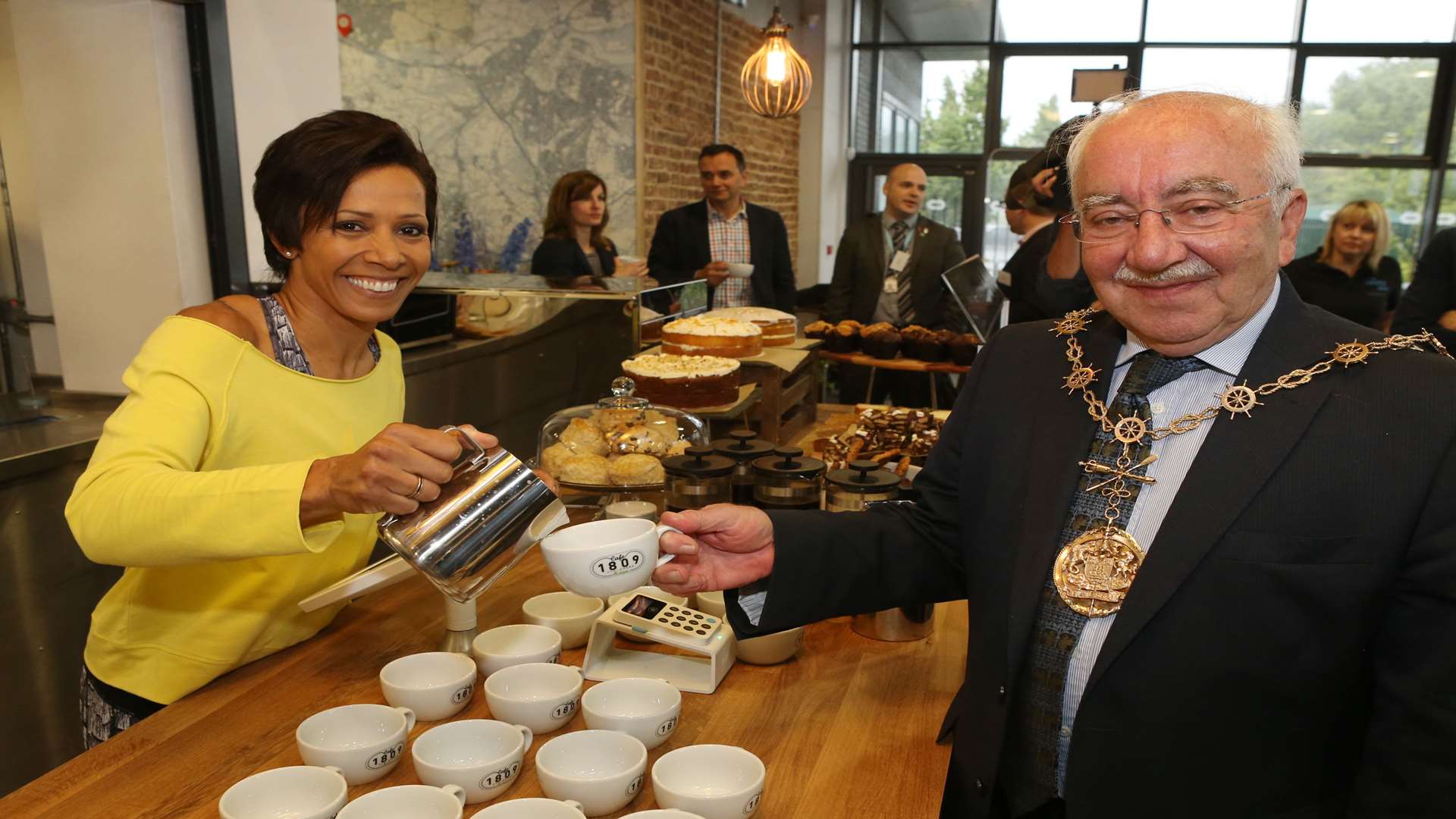 Dame Kelly serves Mayor of Gravesham Cllr Harold Craske at the opening of the cafe in June. Picture: John Westhrop