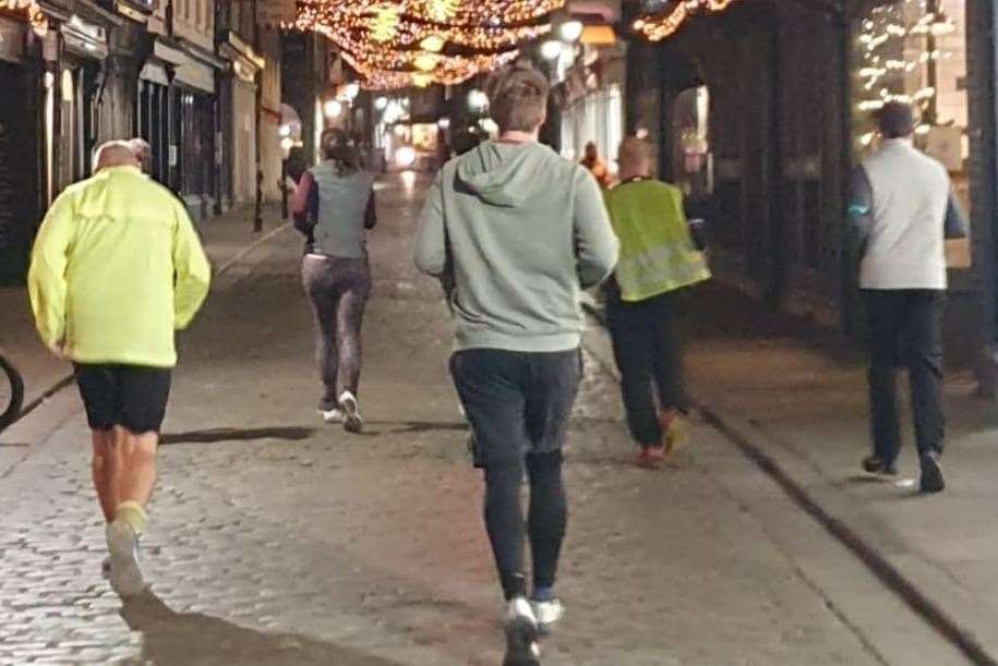 RunTogether Canterbury runners go through the city at night