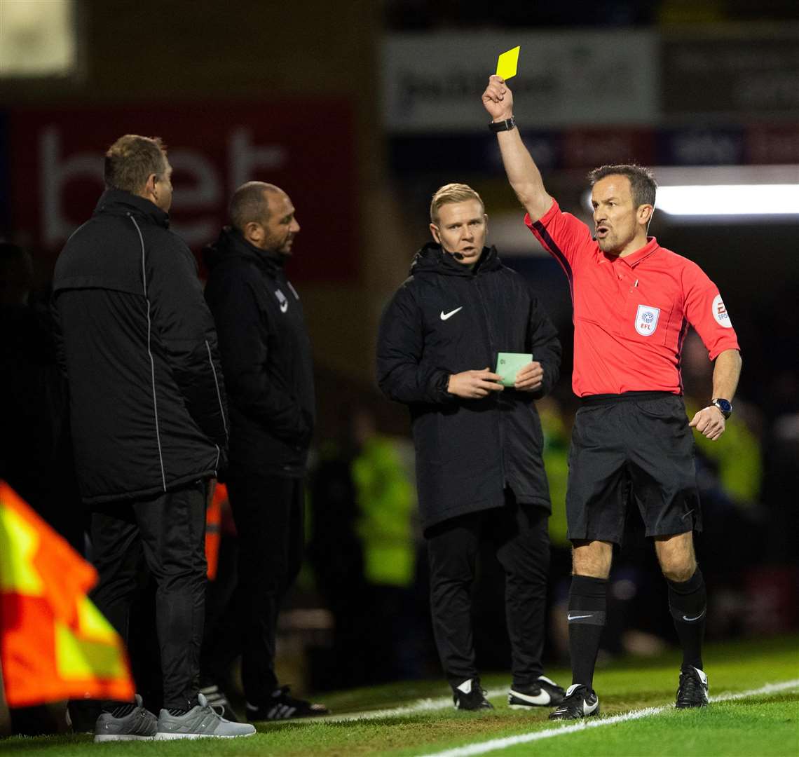 Gillingham manager Steve Lovell (far left) is booked by the referee at Southend Picture: Ady Kerry