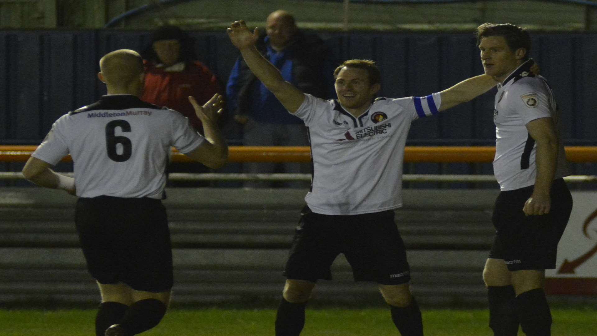 Adam Cunnington (right) celebrates his goal with Kenny Clark and Stuart Lewis Picture: Paul Jarvis
