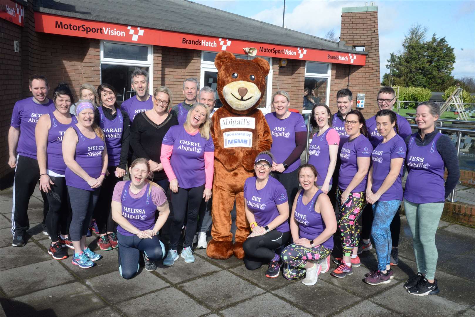 Abigail's Footstep's mascot Abigail Bear with the charity's team of marathon runners at Brands Hatch earlier this year.Picture: Chris Davey