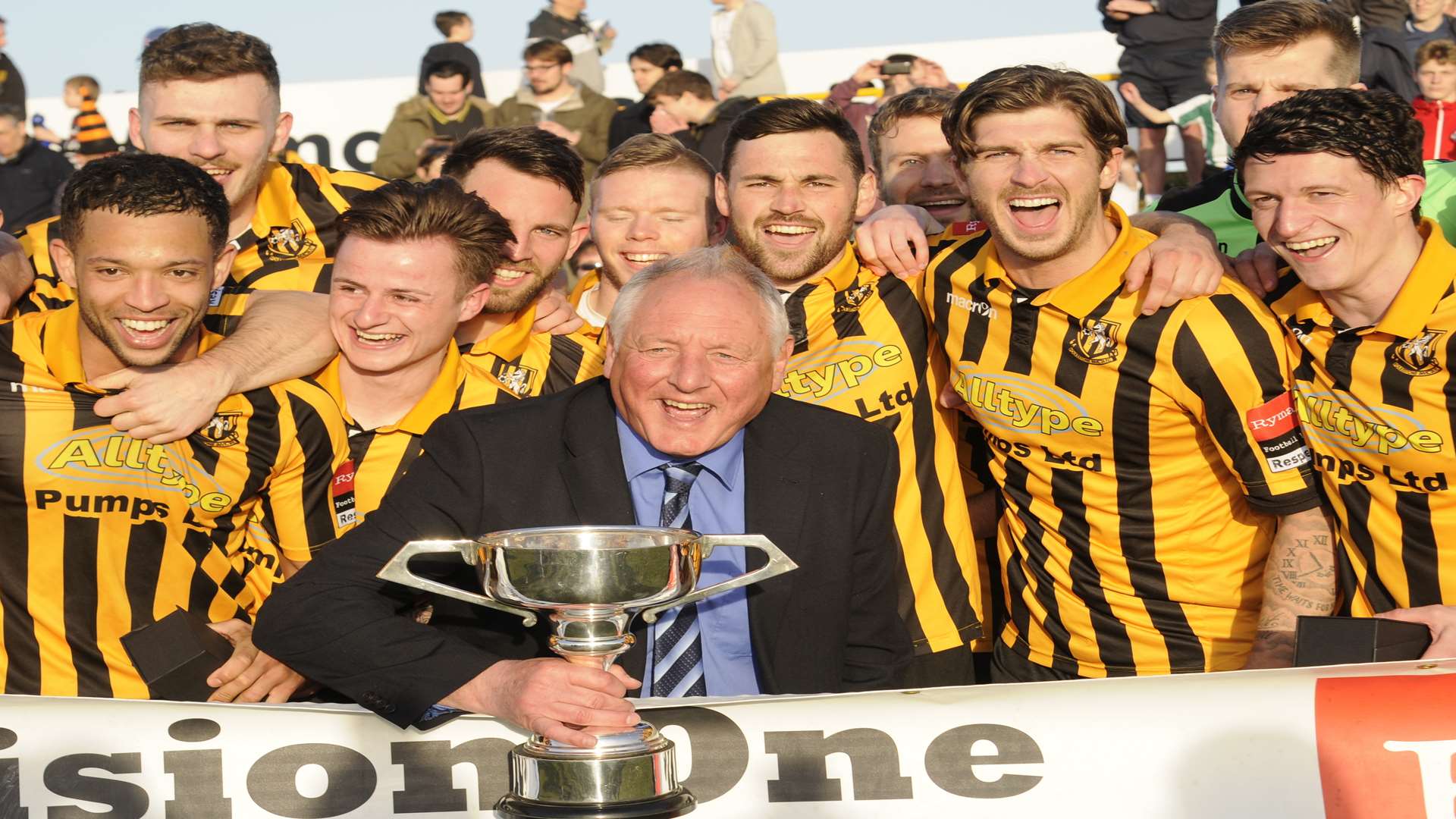 Folkestone boss Neil Cugley and his players celebrate their championship Picture: Gary Browne