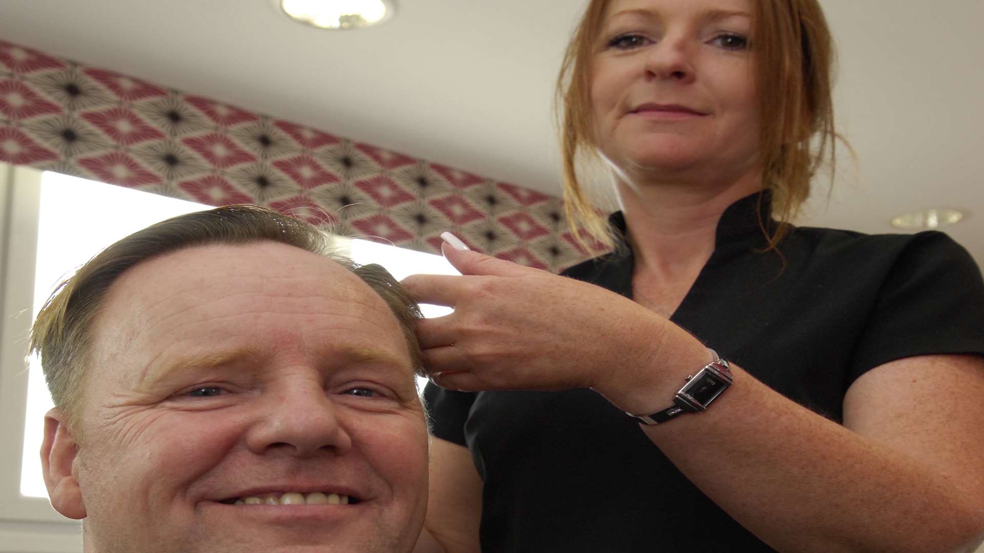 Richard Burke gets his hair cut by Vanessa Osment