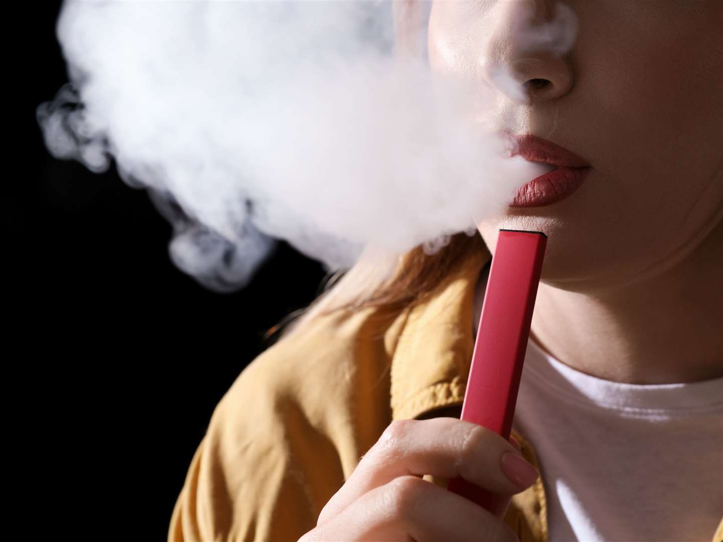 A woman using a disposable vape. Picture: iStock