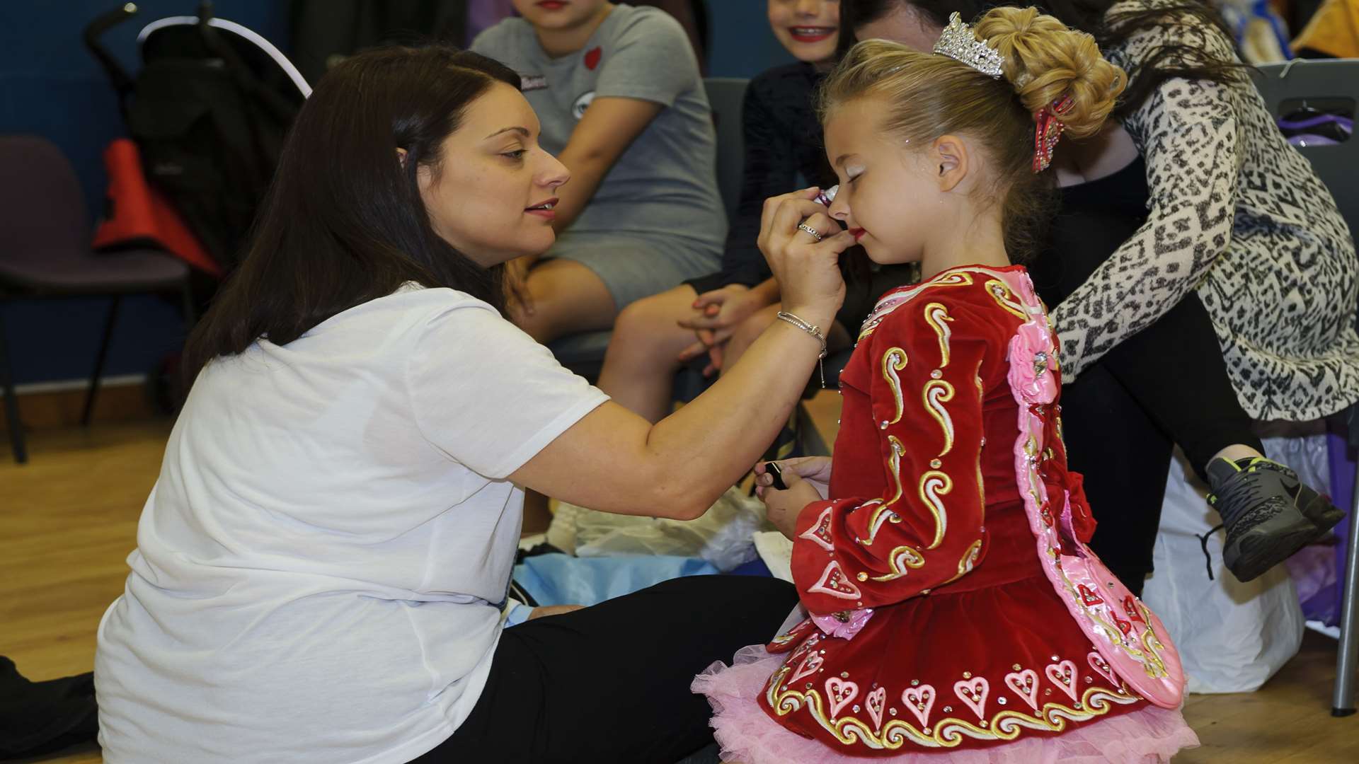 Carla Lee helps get Tia Walsham, eight, ready for the competition. Picture: Andy Payton