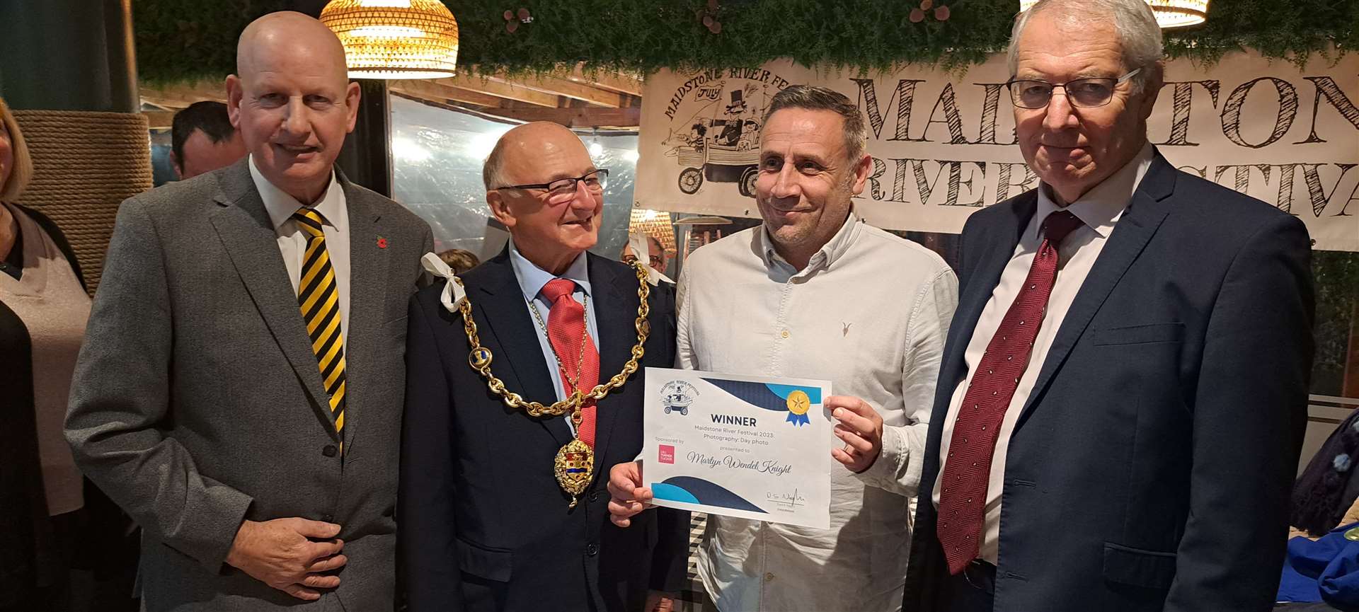 Martyn Knight, who won the prize for best day-time photo, with Dave Naghi, the mayor Gordon Newton, and prize sponsor Robert Green of Gill Turner Tucker