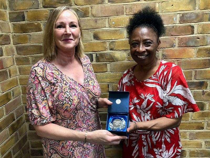 The Ashford Netball League's Denise Chittenden, left, presented with a Kent Netball life membership award by president of Kent Netball, Marlene Wander, at the Kent Netball AGM. Picture: Sian Tempest
