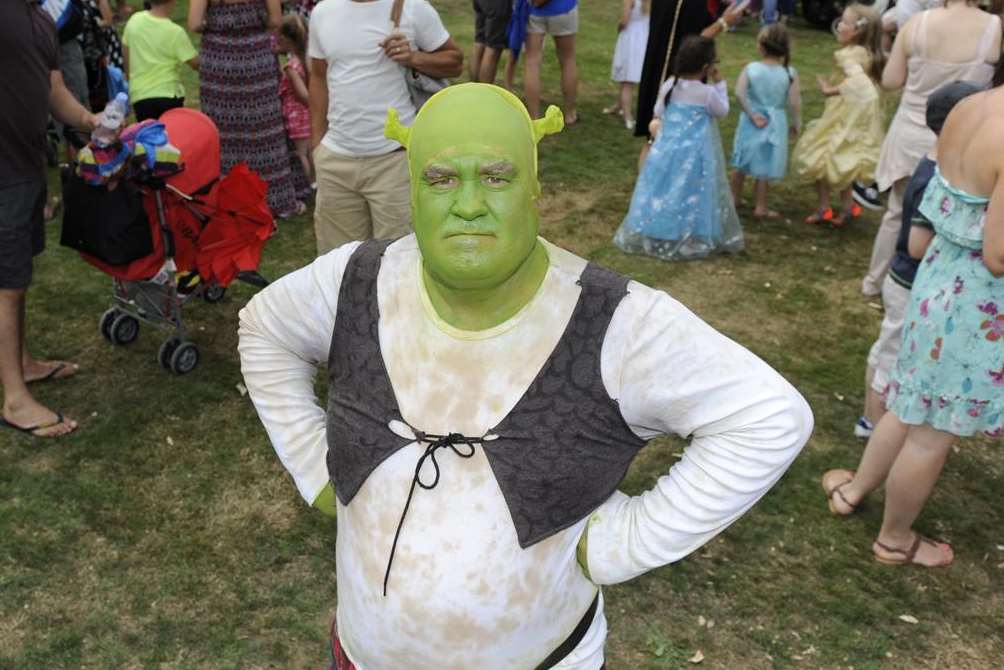 Shrek looking grumpy at the fairytale day